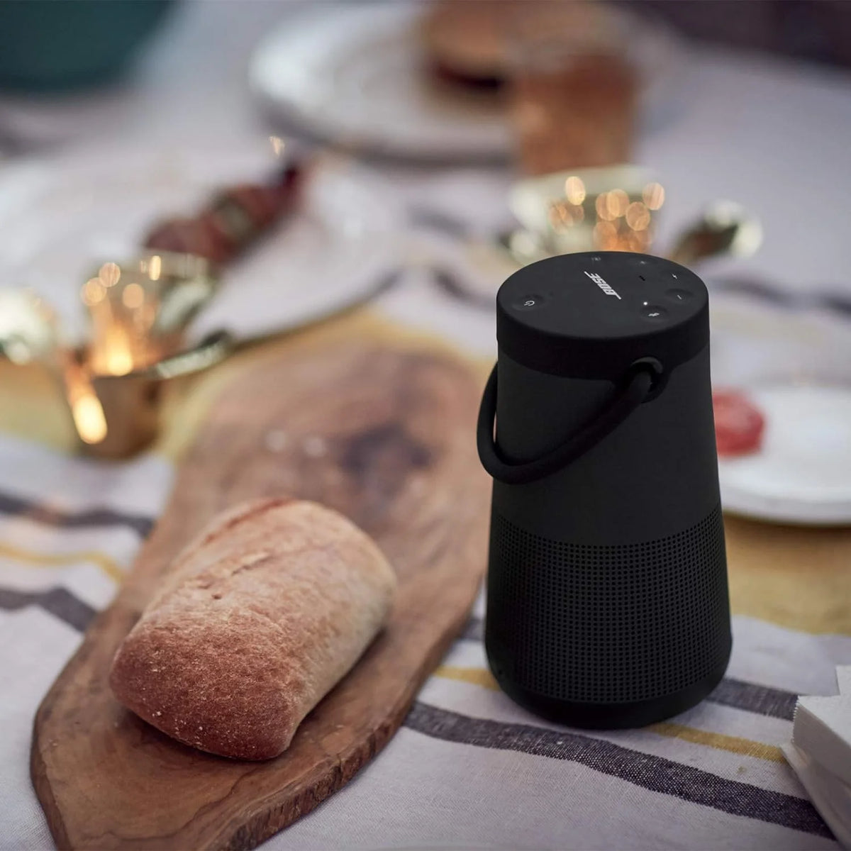 Bluetooth speaker. portable speaker with microphone. wireless and waterproof. 360-degree omnidirectional sound output. long-lasting battery and handle. silver appearance