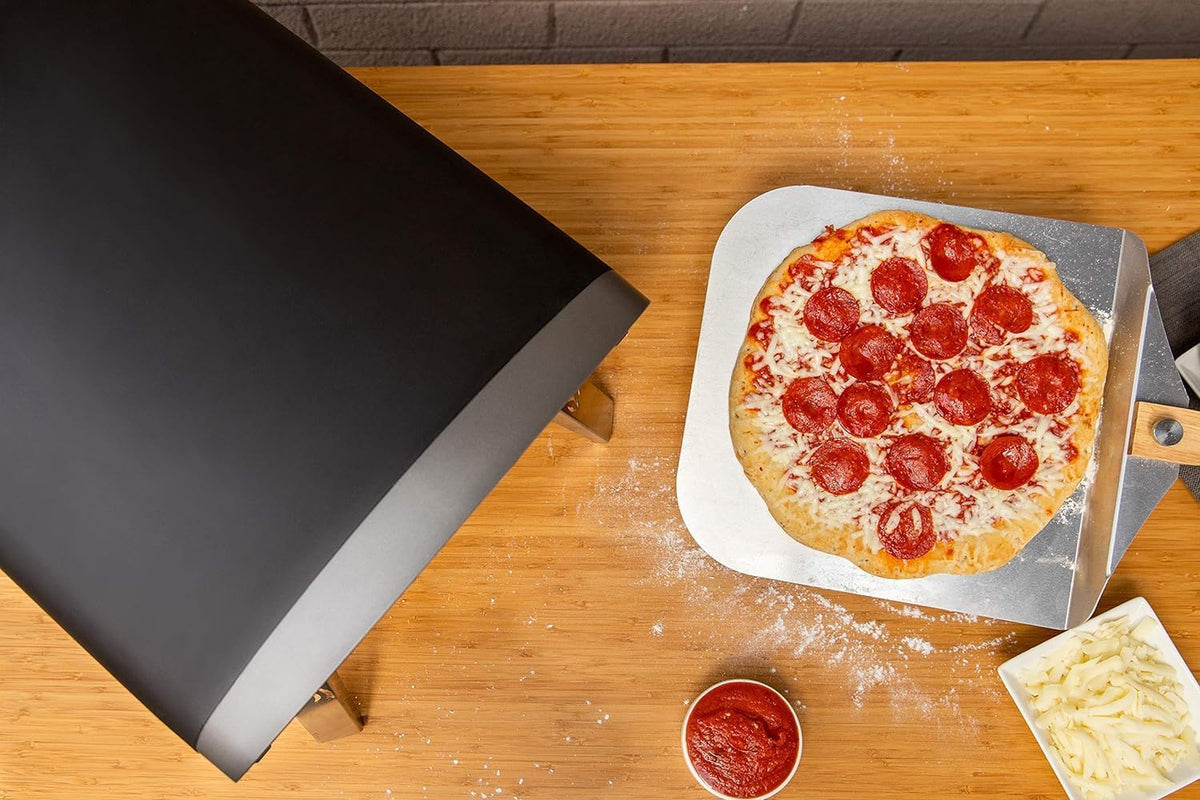 Outdoor gas pizza oven. portable propane pizza grill. equipped with an automatic rotation system and pizza stone