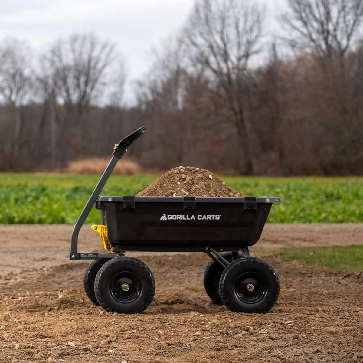 7-Cubic-Foot Poly Dump Garden Cart with No-Flat Tires. 1.200-Lb. Capacity. Black