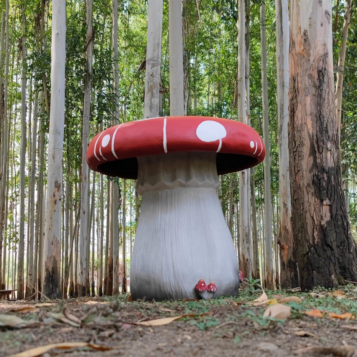 Resin statue 20.8 feet tall. indoor and outdoor dining table. large-sized sculpture. garden lawn. pool decoration. exterior courtyard of buildings. round dining table. chair decoration. red mushrooms
