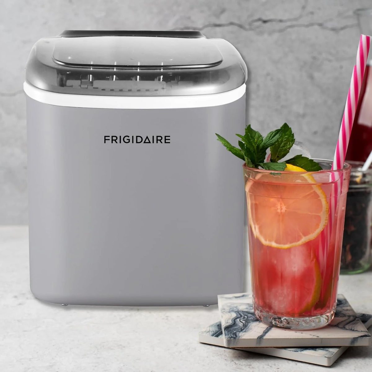 Compact desktop ice machine. capable of producing 26 pounds of ice per day. black color
