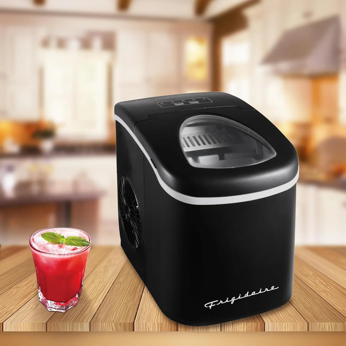 Compact desktop ice machine. capable of producing 26 pounds of ice per day. black color