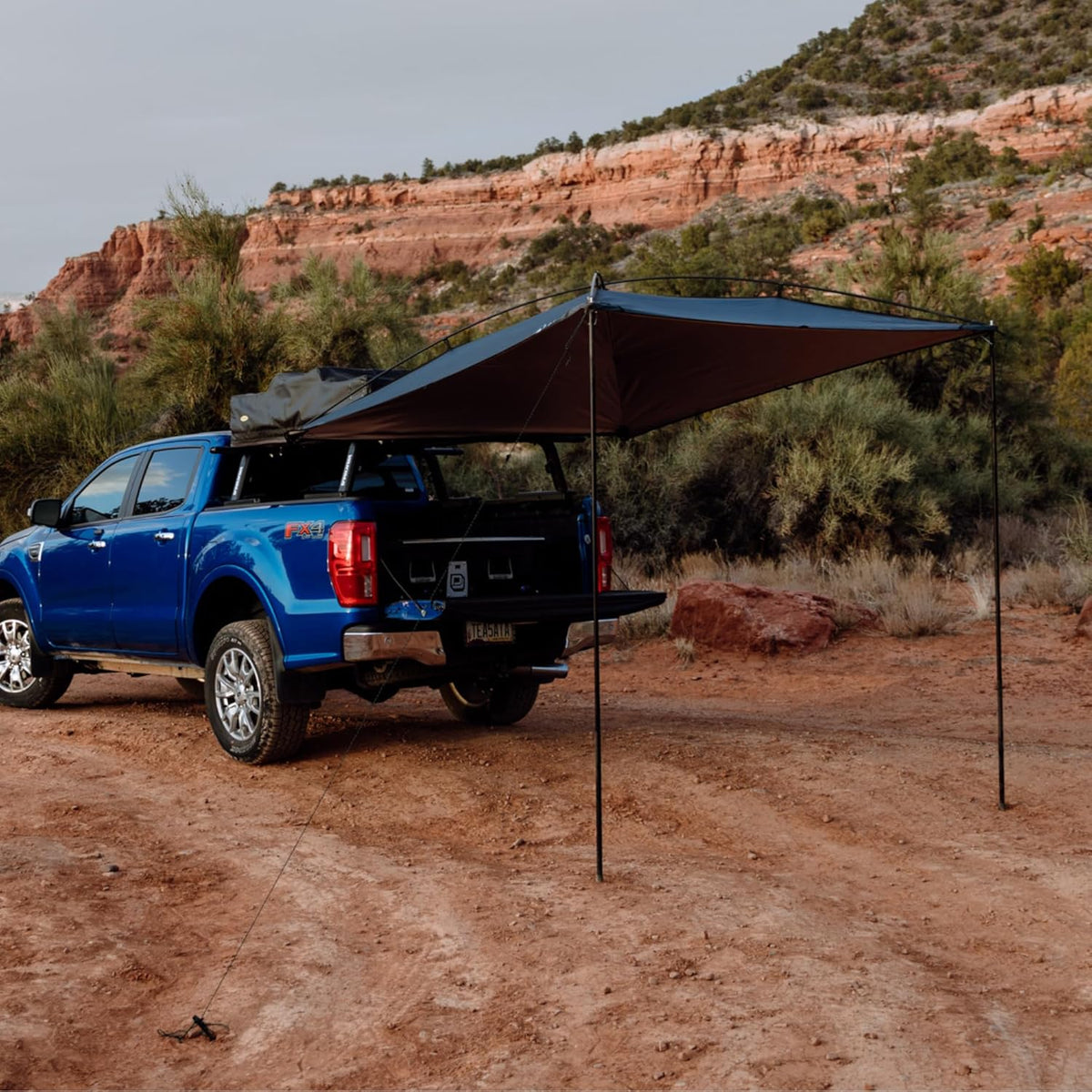 Sunshade portable roof tent. with dimensions of 9 feet by 7 feet. has a large shading area. is lightweight and durable. and is suitable for vehicles such as trucks. SUVs. vans. and camper vans (dark blue)