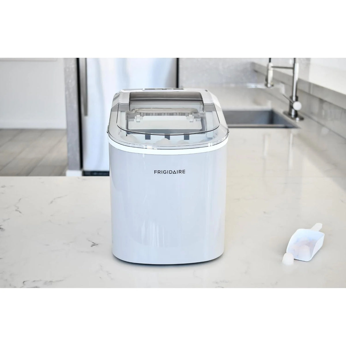 Compact desktop ice machine. capable of producing 26 pounds of ice per day. black color