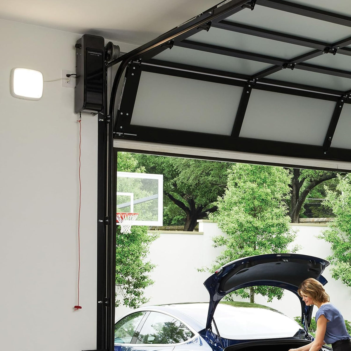 Silent and quiet wall-mounted garage door opener with battery backup and LED lighting. weighing 36 pounds. in black color.