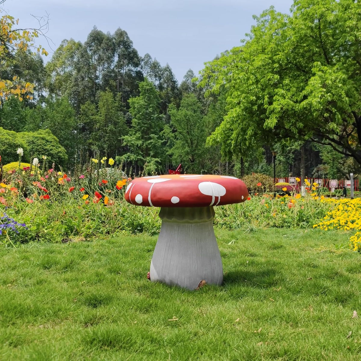 Resin statue 20.8 feet tall. indoor and outdoor dining table. large-sized sculpture. garden lawn. pool decoration. exterior courtyard of buildings. round dining table. chair decoration. red mushrooms