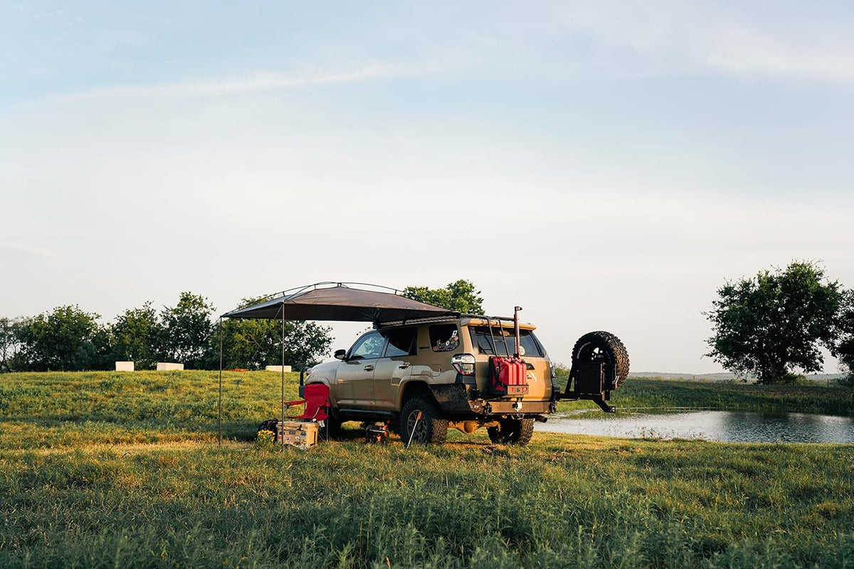 Sunshade portable roof tent. with dimensions of 9 feet by 7 feet. has a large shading area. is lightweight and durable. and is suitable for vehicles such as trucks. SUVs. vans. and camper vans (dark blue)