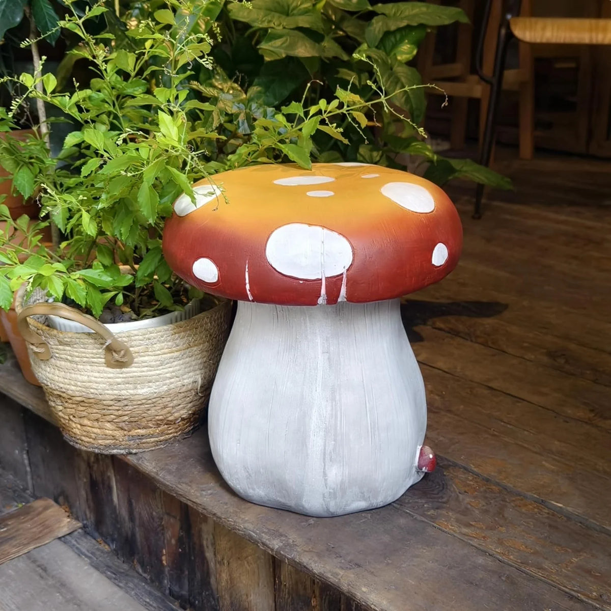 Resin statue 20.8 feet tall. indoor and outdoor dining table. large-sized sculpture. garden lawn. pool decoration. exterior courtyard of buildings. round dining table. chair decoration. red mushrooms