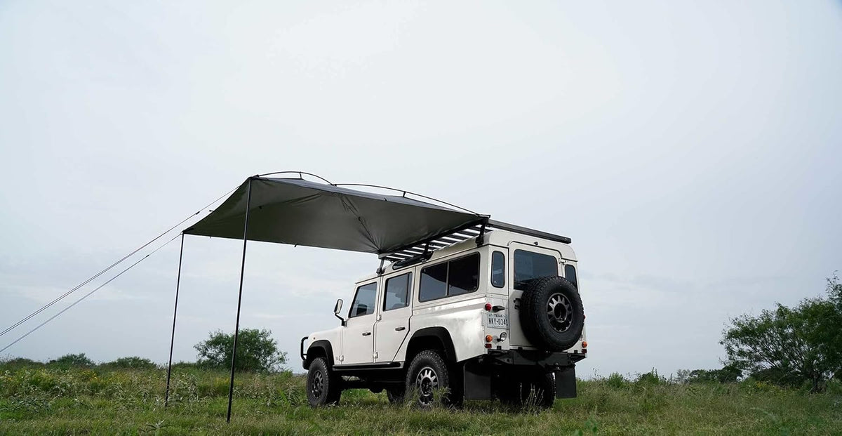 Sunshade portable roof tent. with dimensions of 9 feet by 7 feet. has a large shading area. is lightweight and durable. and is suitable for vehicles such as trucks. SUVs. vans. and camper vans (dark blue)