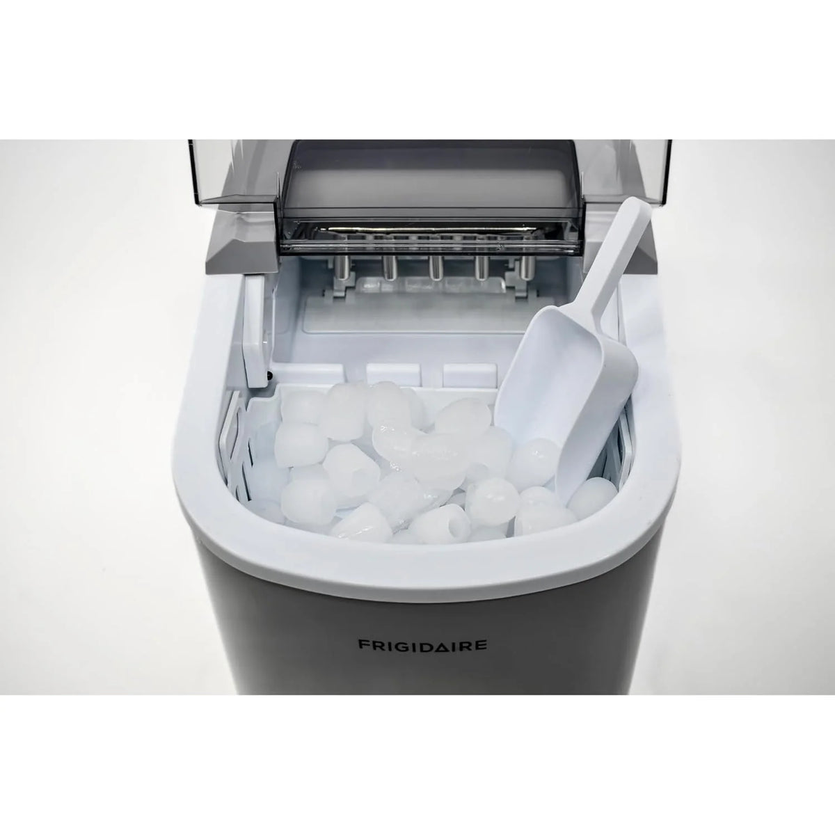 Compact desktop ice machine. capable of producing 26 pounds of ice per day. black color