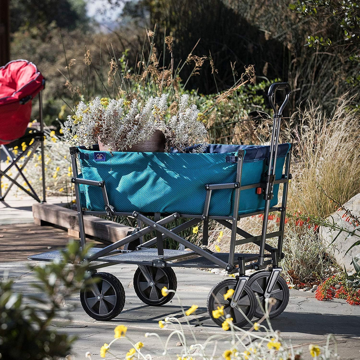 A foldable double-layer outdoor multi-functional truck. equipped with a long lower shelf. in blue-green color.