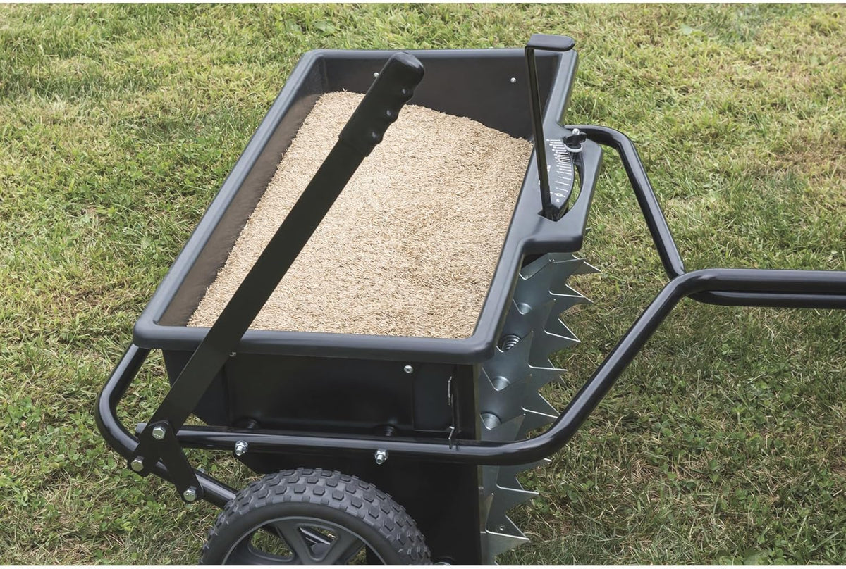 100-pound traction type seeder/seeder/sprayer. black version