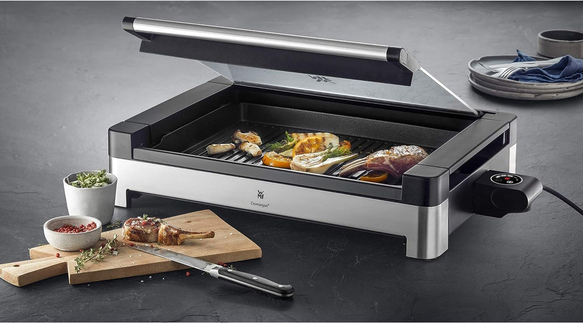 WMF Lono Tischgrill elektrisch mit Glasdeckel. beschichtete Grillplatte. herausnehmbare Auffangschale. spülmaschinenfest. Edelstahl matt. 2200 Watt