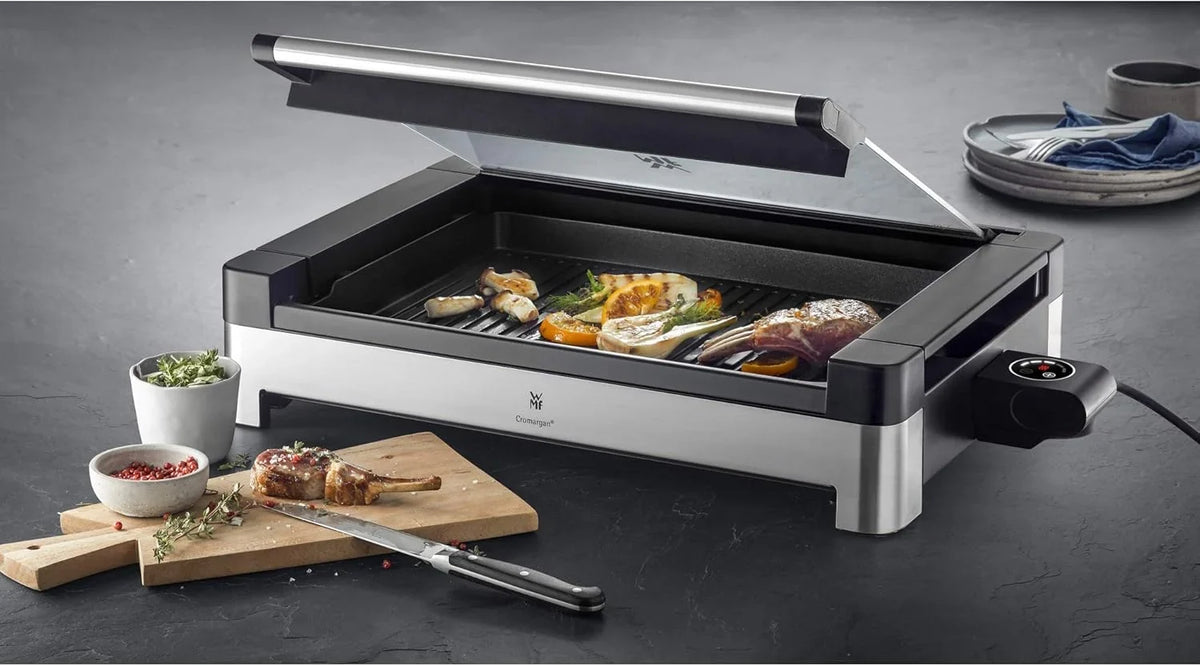 WMF Lono Tischgrill elektrisch mit Glasdeckel. beschichtete Grillplatte. herausnehmbare Auffangschale. spülmaschinenfest. Edelstahl matt. 2200 Watt