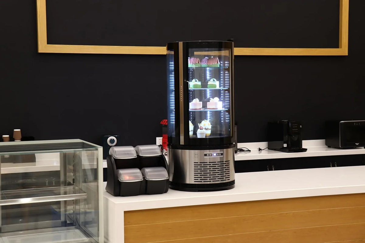 METRO Professional Kuchen-Vitrine GRV1100. Gastro. Edelstahl/Glas. 100 L. Umluftkühlung. 490W. Temperaturanzeige. automatisches Abtauen. rund. silber.